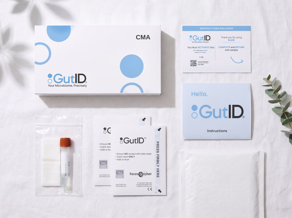 The GutID kit laid out: the box, the activation card, the instructions and the collection tube